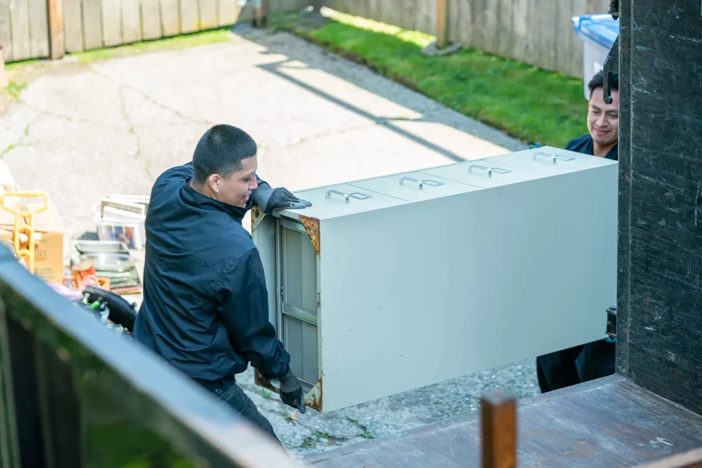 two men carry junk removal in Kent