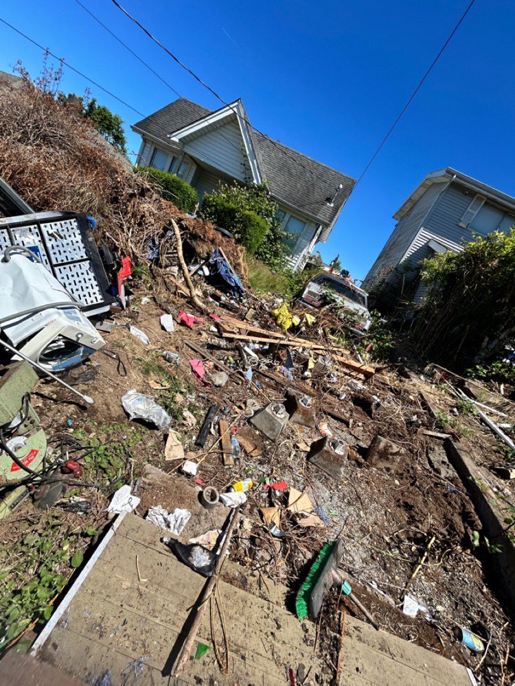 Before: yard full of construction and demolition debris