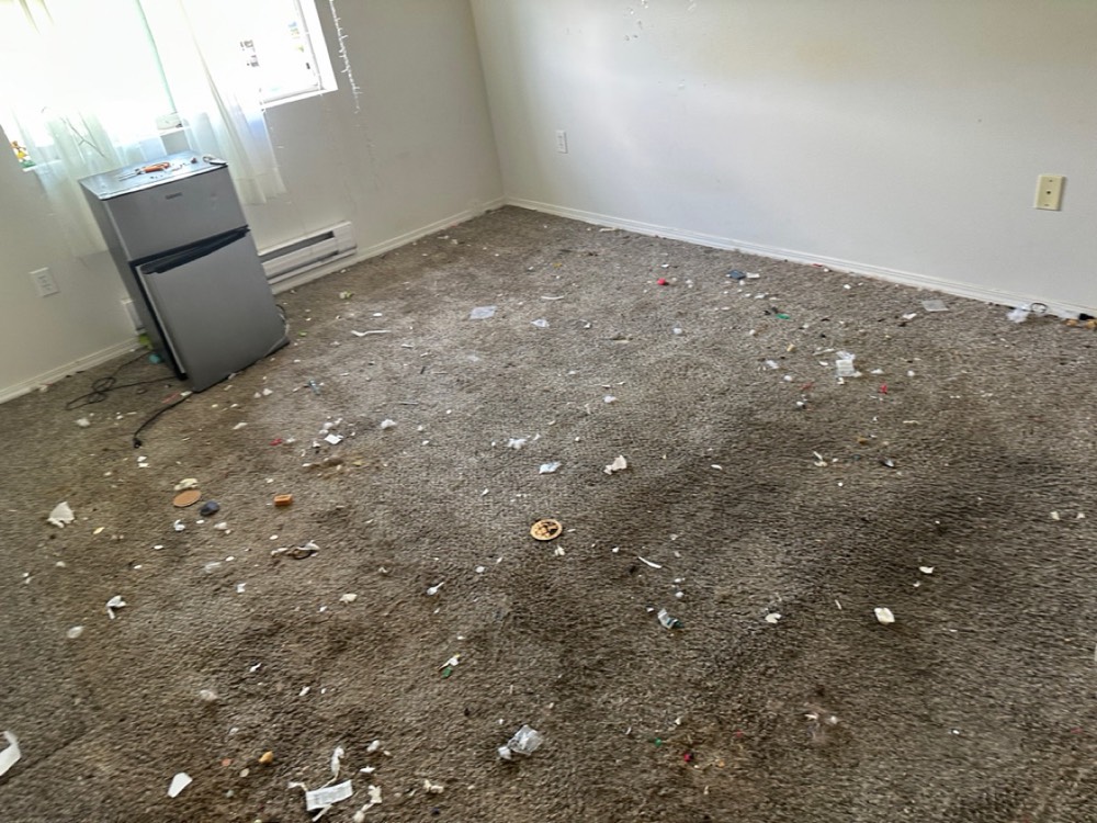 Before: debris-strewn room mid-clear