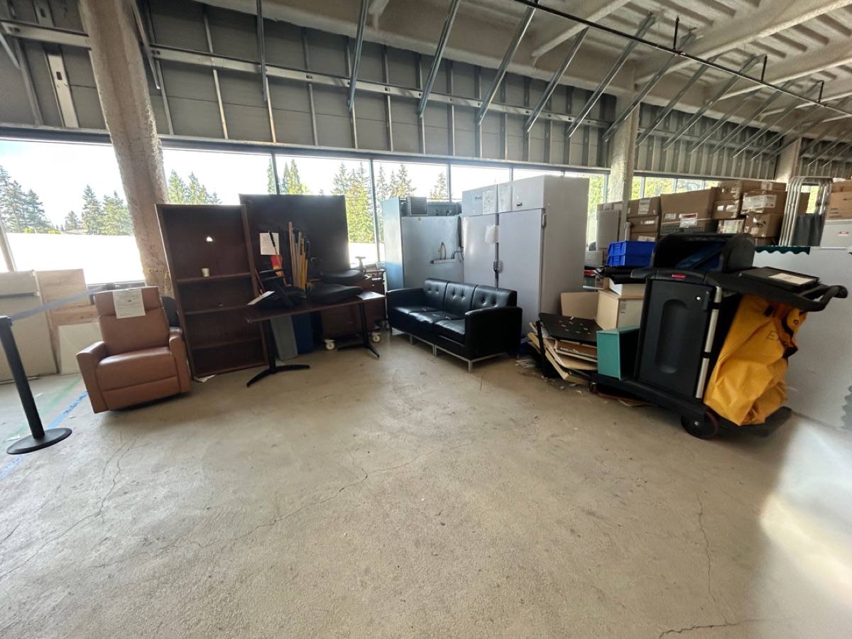 Large warehouse floor cleared and swept by 99 Junk Removal
